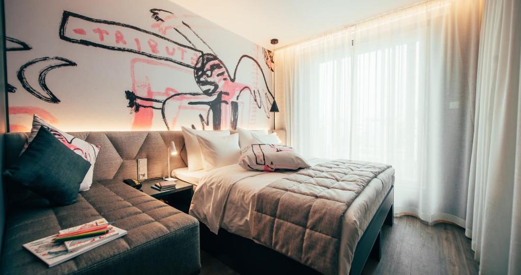 Ένα ή περισσότερα κρεβάτια σε δωμάτιο στο Hotel AX