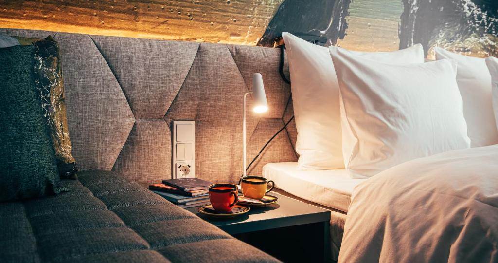 Ένα ή περισσότερα κρεβάτια σε δωμάτιο στο Hotel AX
