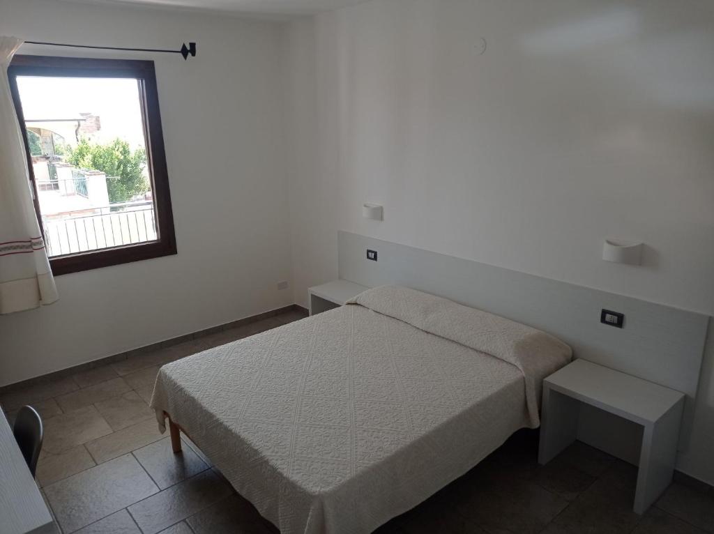 Postel nebo postele na pokoji v ubytování B&B da Rosella