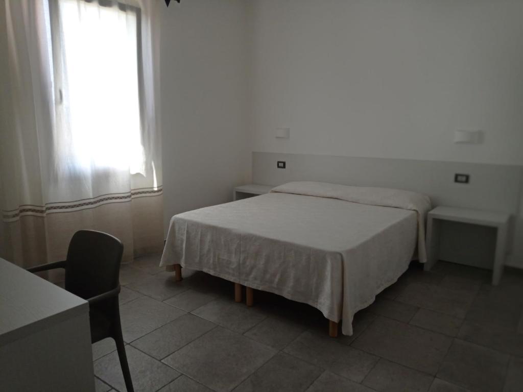 Postel nebo postele na pokoji v ubytování B&B da Rosella