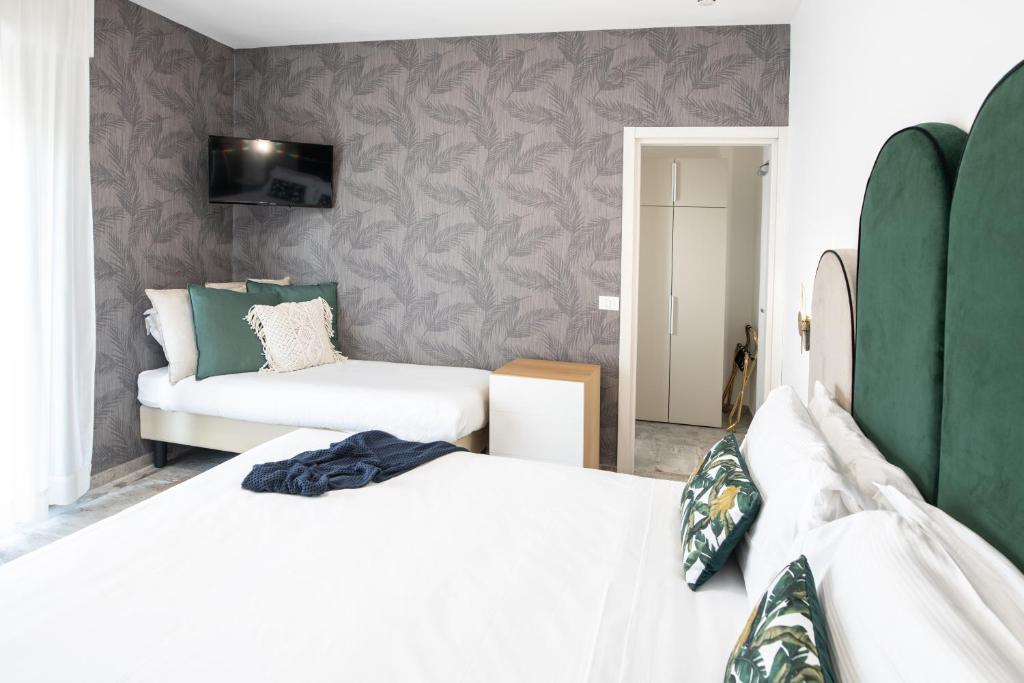 Postel nebo postele na pokoji v ubytování Hotel Brennero
