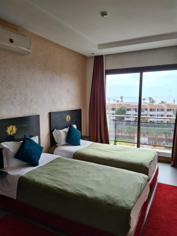 Postel nebo postele na pokoji v ubytování La Suite Hotel Agadir Adults Only