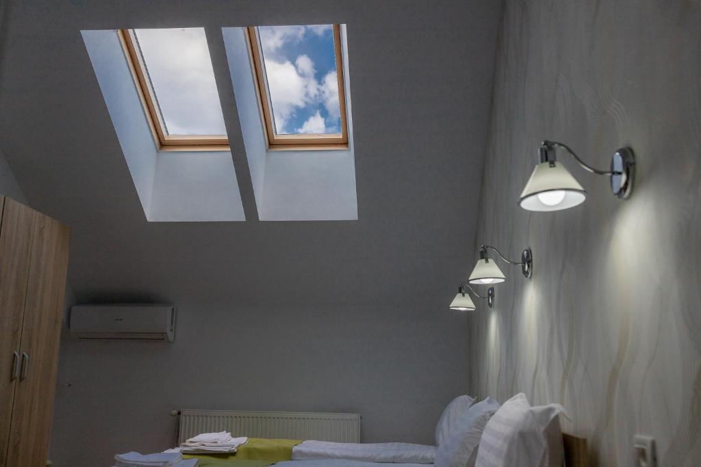 Postel nebo postele na pokoji v ubytování MARCONI GUESTHOUSE