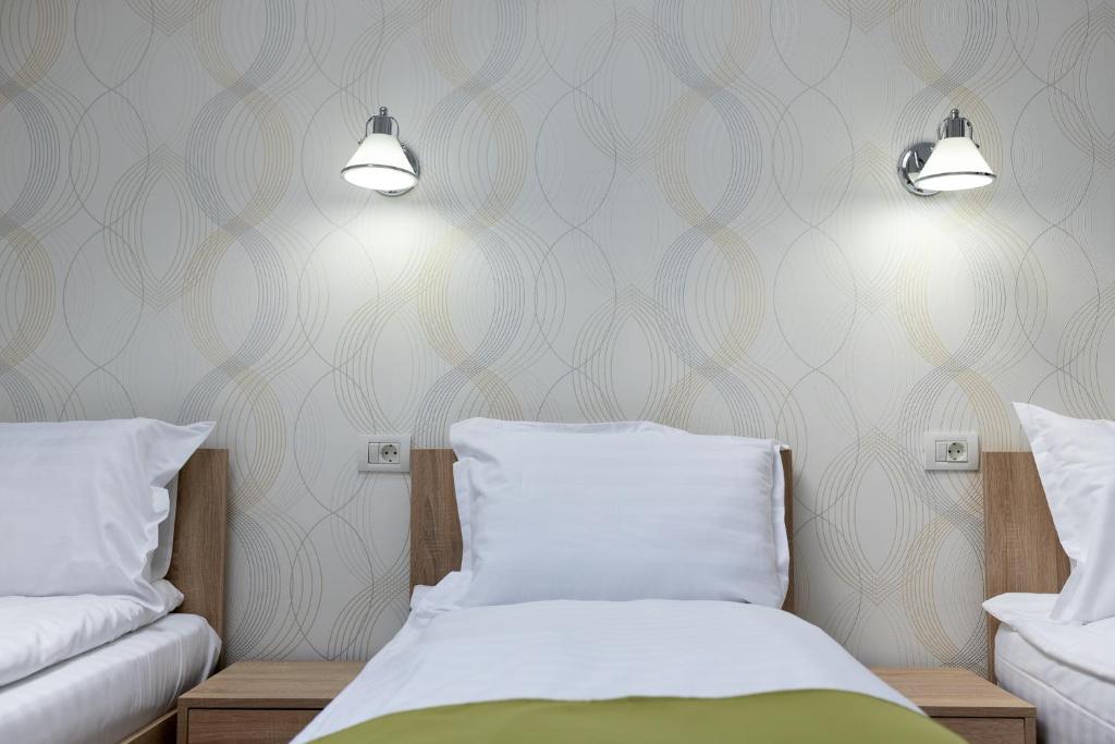 Postel nebo postele na pokoji v ubytování MARCONI GUESTHOUSE