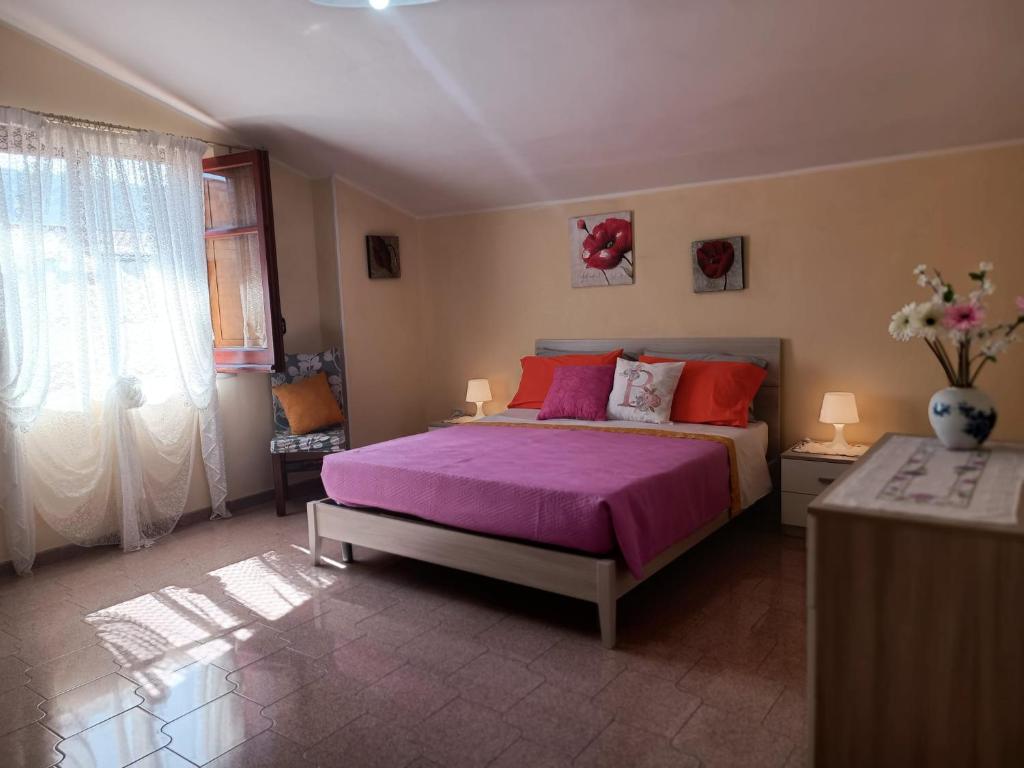 Postel nebo postele na pokoji v ubytování Casa AuroraRosa