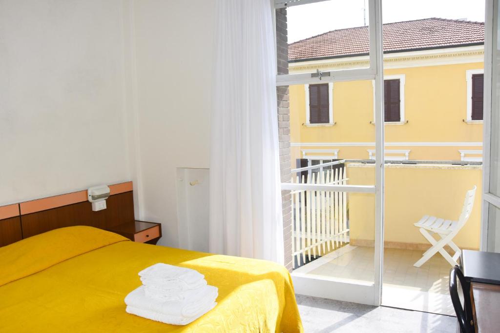 Postel nebo postele na pokoji v ubytování Hotel Suprem sul Mare