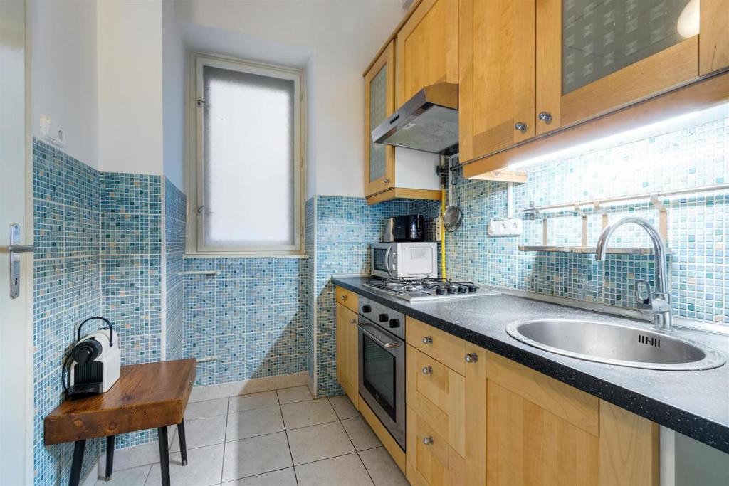 Kuchyňa alebo kuchynka v ubytovaní Liberty Square Apartment