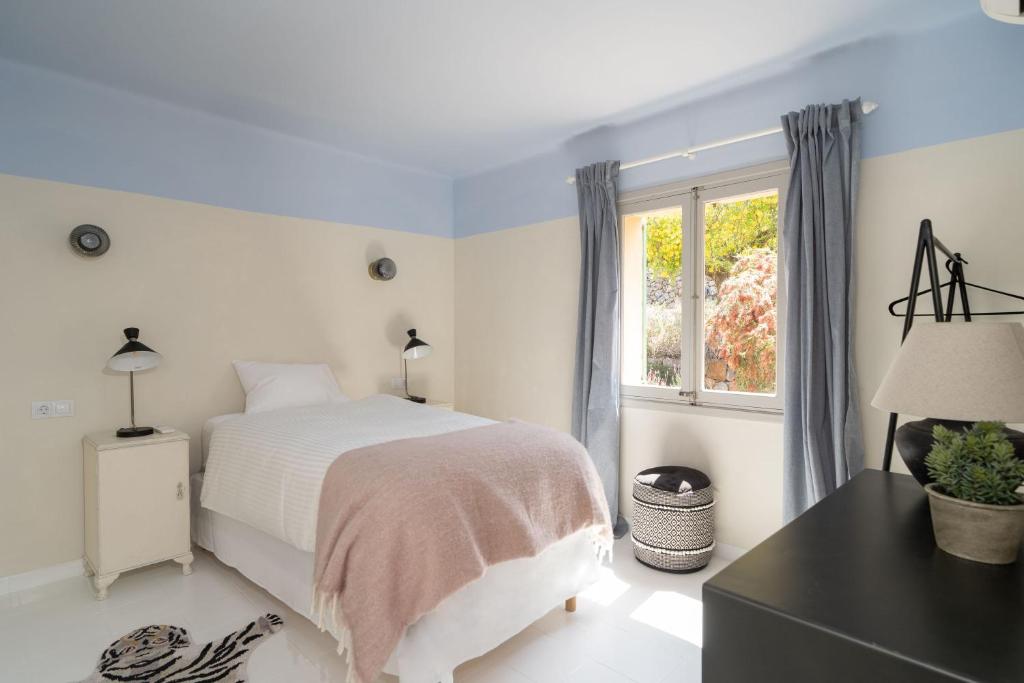 A bed or beds in a room at CA'N QUINN