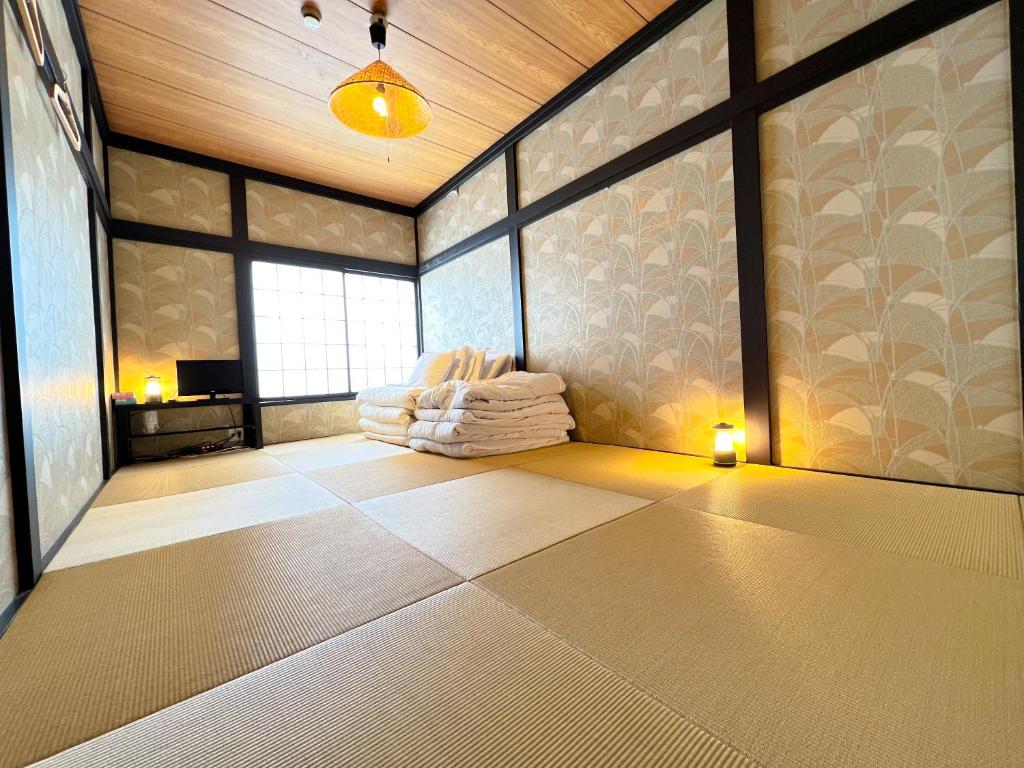 Postel nebo postele na pokoji v ubytování ザホテル湯沢スターダスト