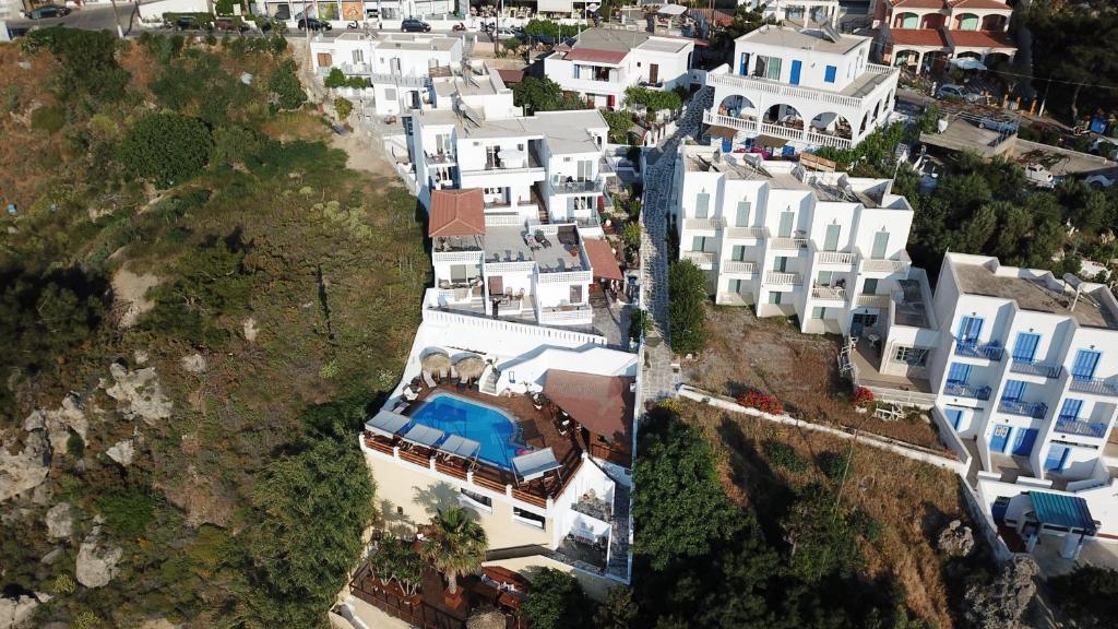 an aerial view of a city with white buildings at Fatolitis Studios in Masouri