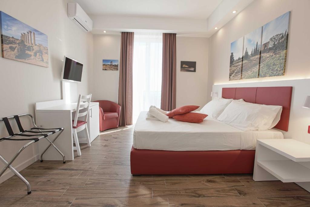 Postel nebo postele na pokoji v ubytování Esseneto Rooms
