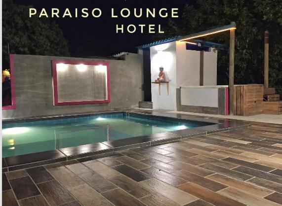 a swimming pool in a hotel with the words panama lounge hotel at Paraiso Lounge in Santa Marta