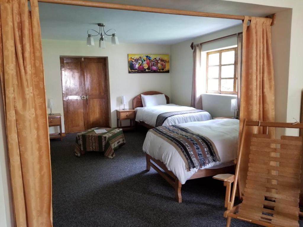 Postel nebo postele na pokoji v ubytování Apu Lodge