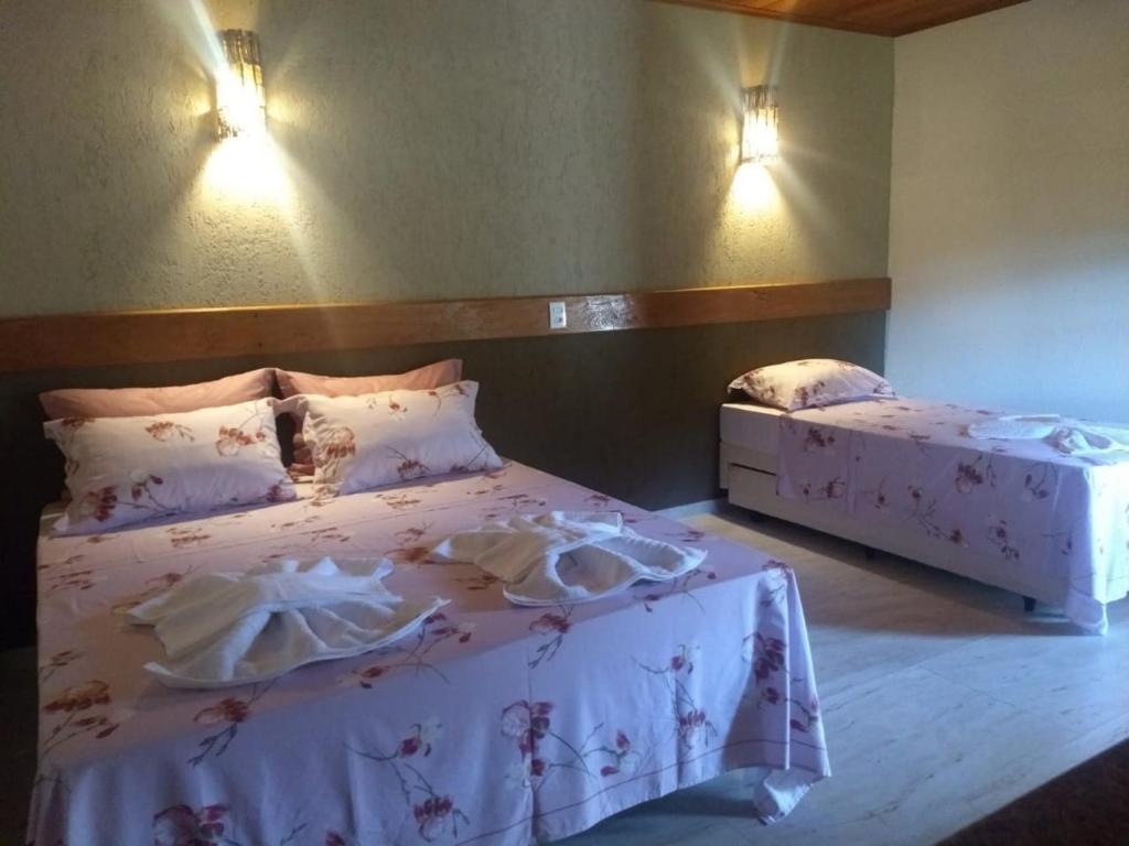 Postel nebo postele na pokoji v ubytování Recanto da Roca