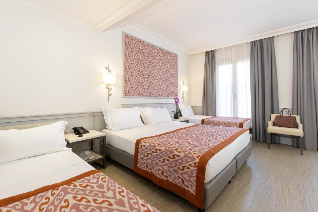 Postel nebo postele na pokoji v ubytování Hotel Della Conciliazione