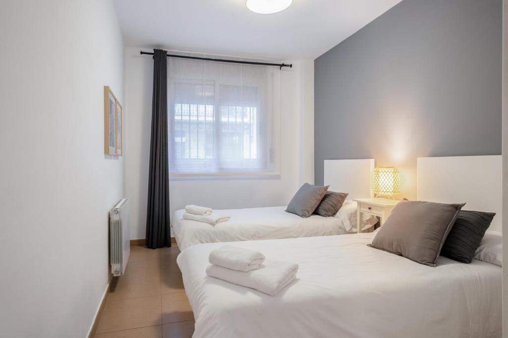 Postel nebo postele na pokoji v ubytování Inside Barcelona Apartments Salva