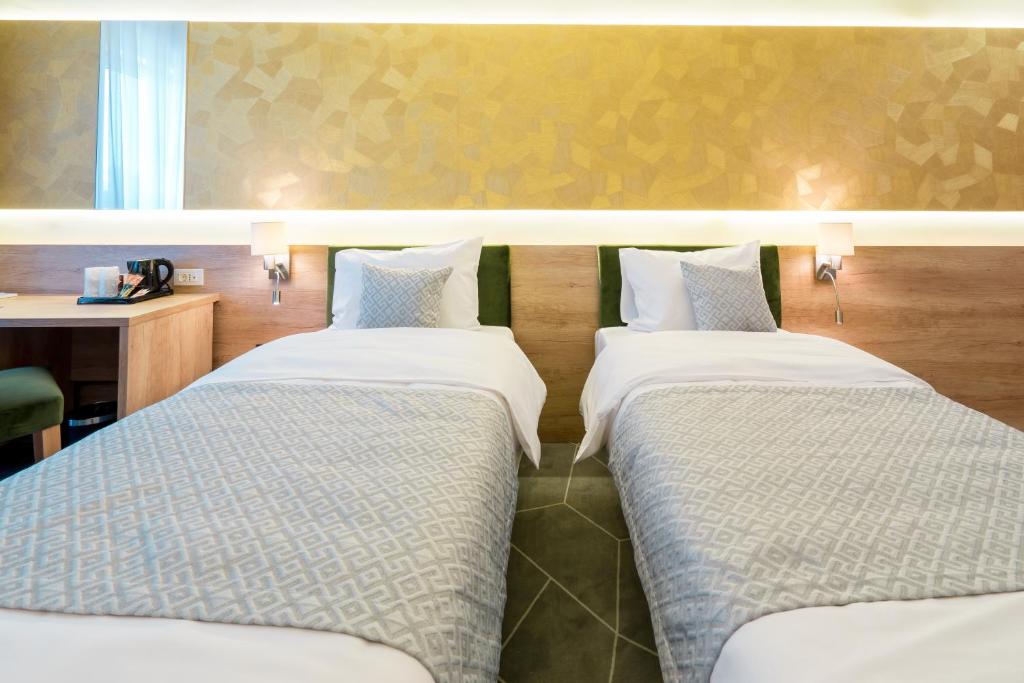 Postel nebo postele na pokoji v ubytování Hotel Console