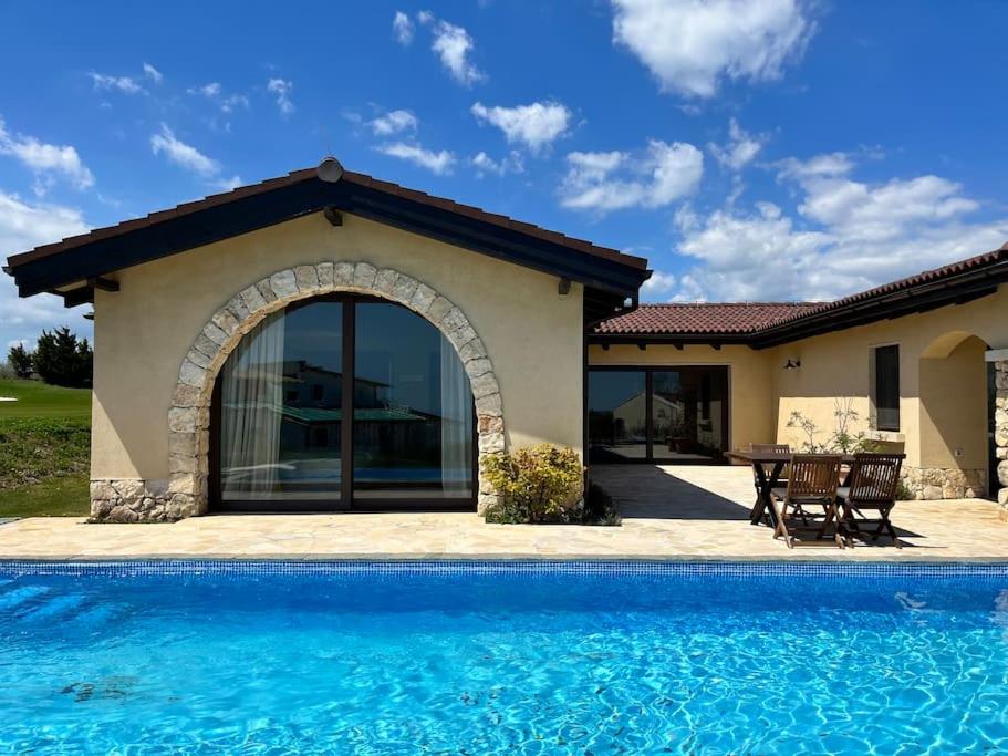 The swimming pool at or close to Private Villa at BlackSeaRama Golf & Villas Resort