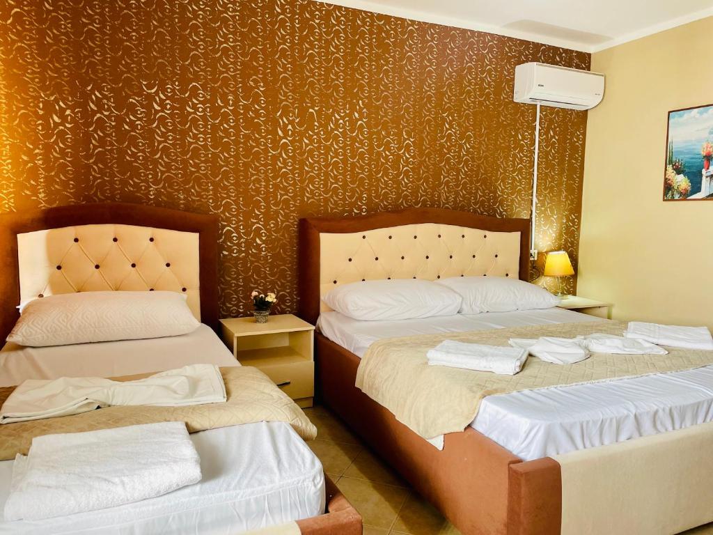 Postel nebo postele na pokoji v ubytování Vila3 Hotel
