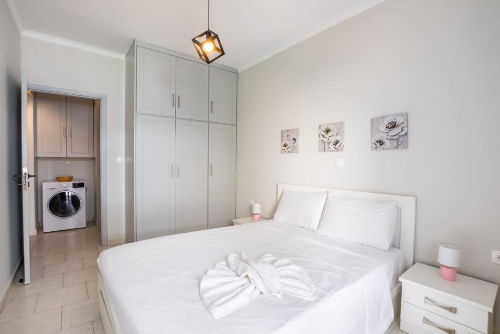 Postel nebo postele na pokoji v ubytování Lilis Apartment 3