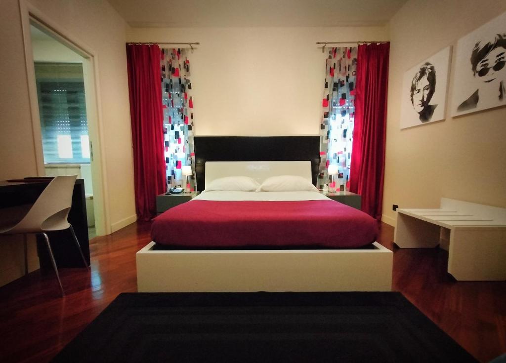 Postel nebo postele na pokoji v ubytování Hotel L' Orto degli Otelli