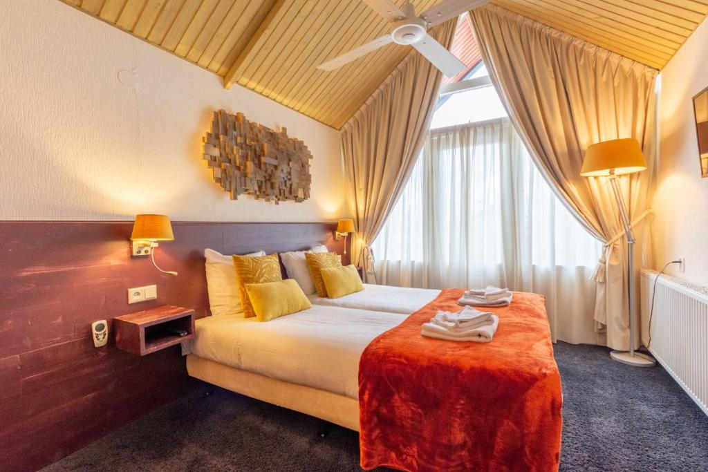 Katil atau katil-katil dalam bilik di Hotel Hartlief