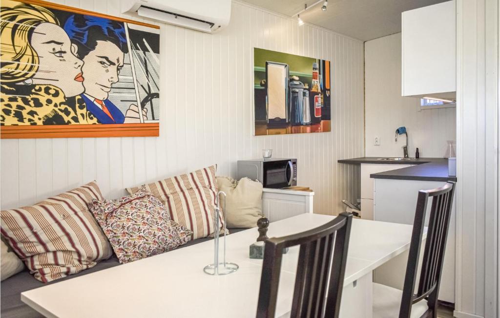 a living room with a couch and a table at Stunning Apartment In Sölvesborg in Sölvesborg
