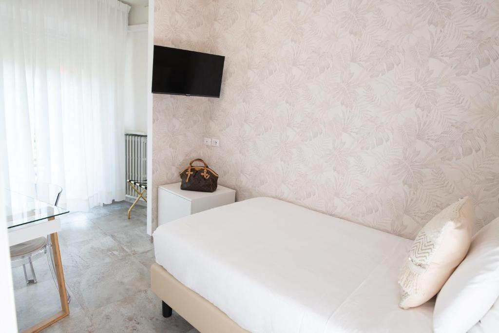 Postel nebo postele na pokoji v ubytování Hotel Brennero