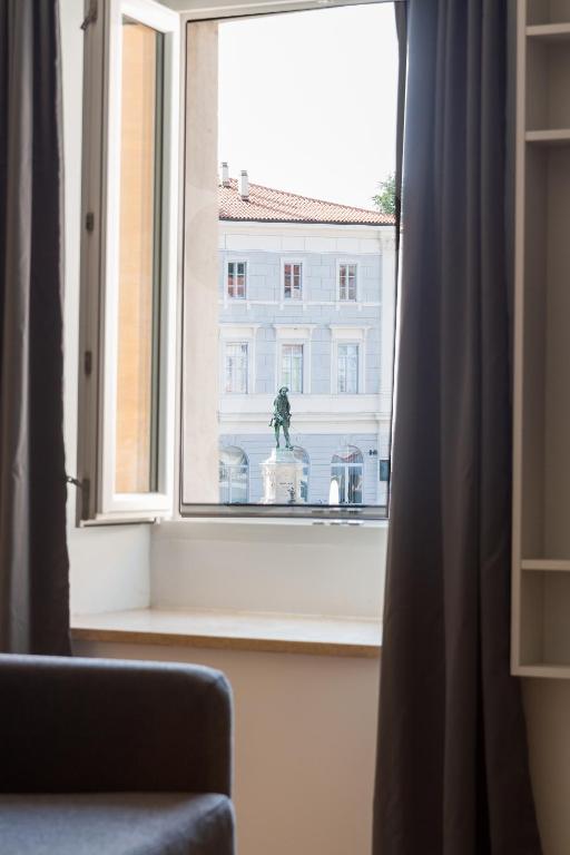 a window with a view of a building at Premium Tartini Apartment 2 by Locap Group in Piran