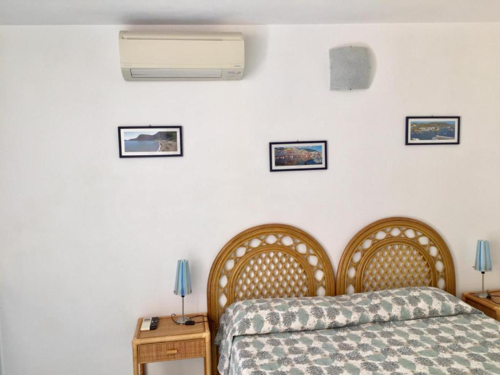 Postel nebo postele na pokoji v ubytování Vento di Terra Ponza