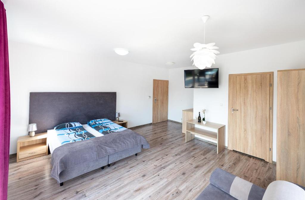Postel nebo postele na pokoji v ubytování Apartamenty HELJAN