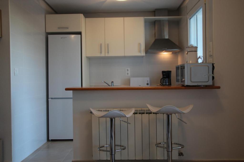 Kuchyň nebo kuchyňský kout v ubytování Adosado Roldán by Rental Olé
