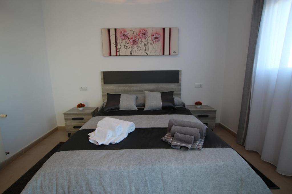 Postel nebo postele na pokoji v ubytování Adosado Roldán by Rental Olé