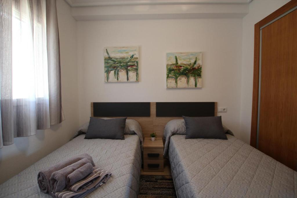 Postel nebo postele na pokoji v ubytování Adosado Roldán by Rental Olé