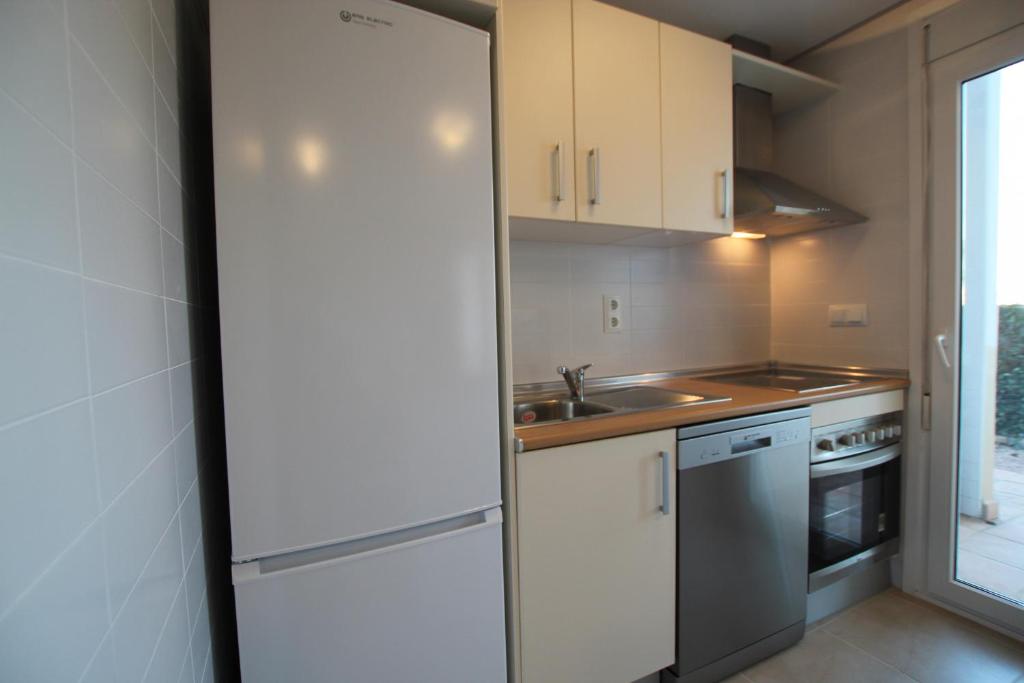 Kuchyň nebo kuchyňský kout v ubytování Adosado Roldán by Rental Olé
