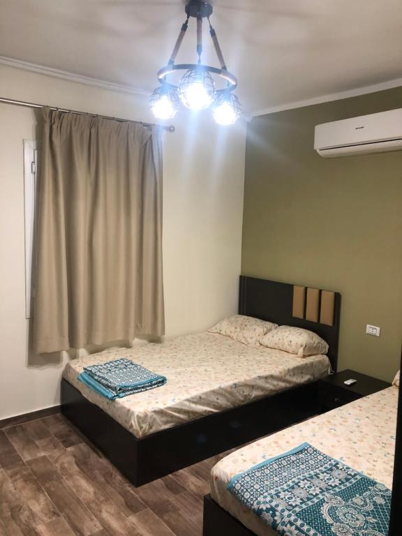 A bed or beds in a room at Fancy sea view villa with private jacuzzi mountain view north coast Bait Karim - Twin Villa with roof & juccuzi