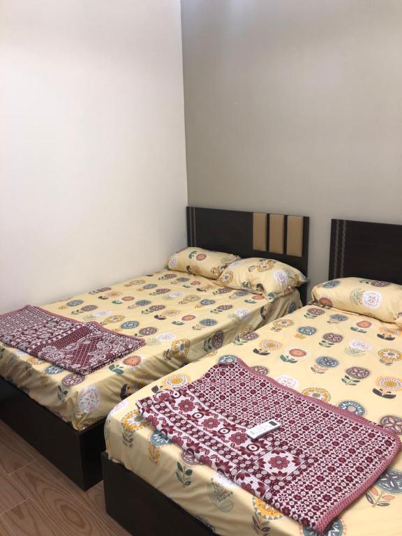 A bed or beds in a room at Fancy sea view villa with private jacuzzi mountain view north coast Bait Karim - Twin Villa with roof & juccuzi
