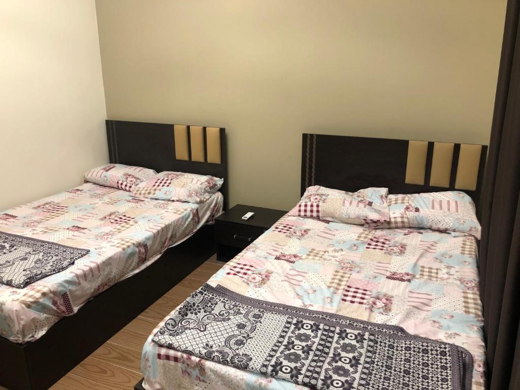 A bed or beds in a room at Fancy sea view villa with private jacuzzi mountain view north coast Bait Karim - Twin Villa with roof & juccuzi