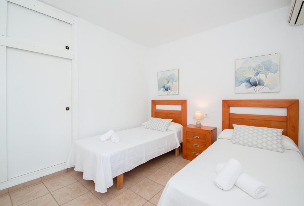 Łóżko lub łóżka w pokoju w obiekcie Villa Felita by Sonne Villas