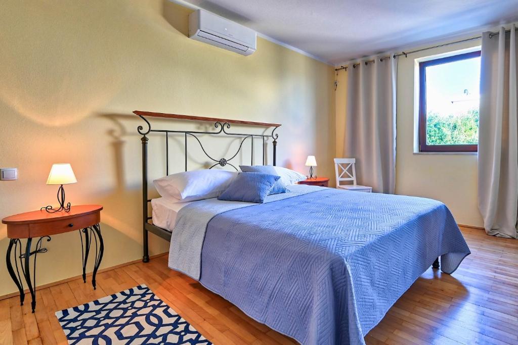 Postel nebo postele na pokoji v ubytování Villa Oscar, Zadar