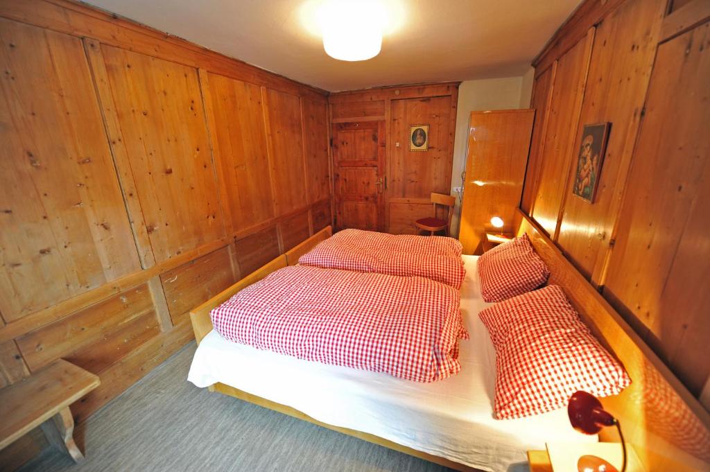 A bed or beds in a room at Apartments Smidl