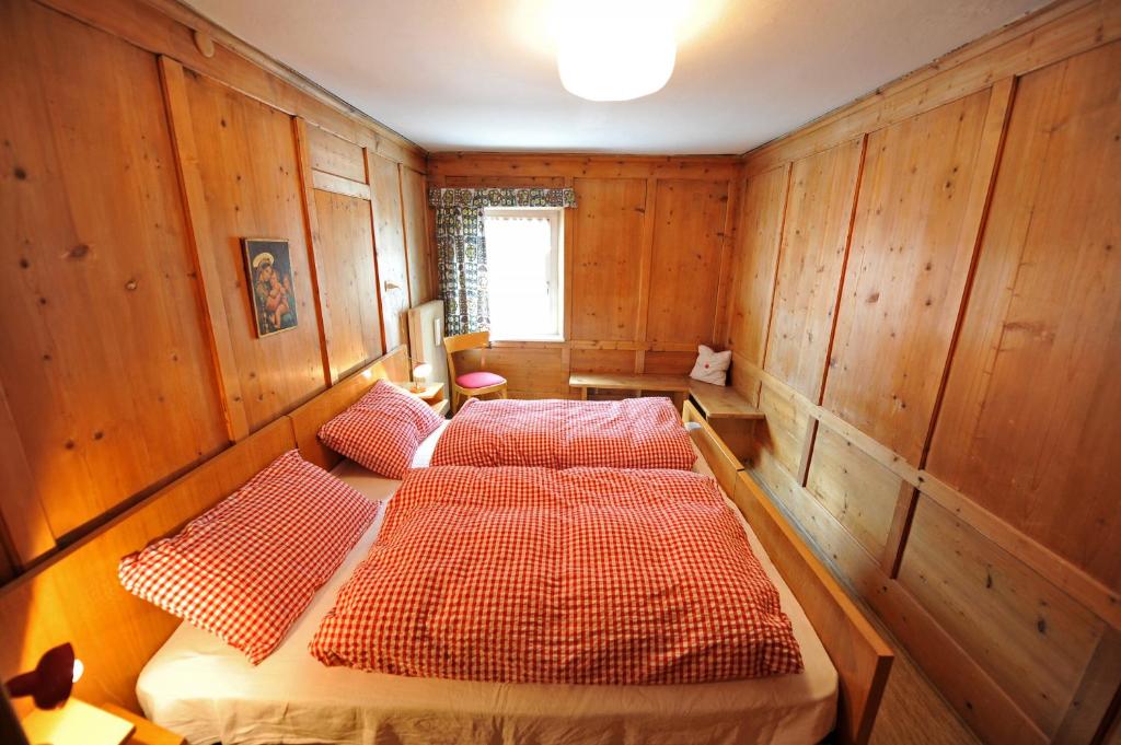 A bed or beds in a room at Apartments Smidl