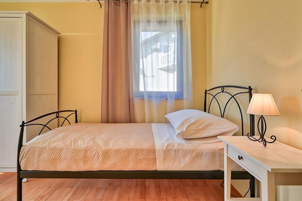 Postel nebo postele na pokoji v ubytování Villa Oscar, Zadar