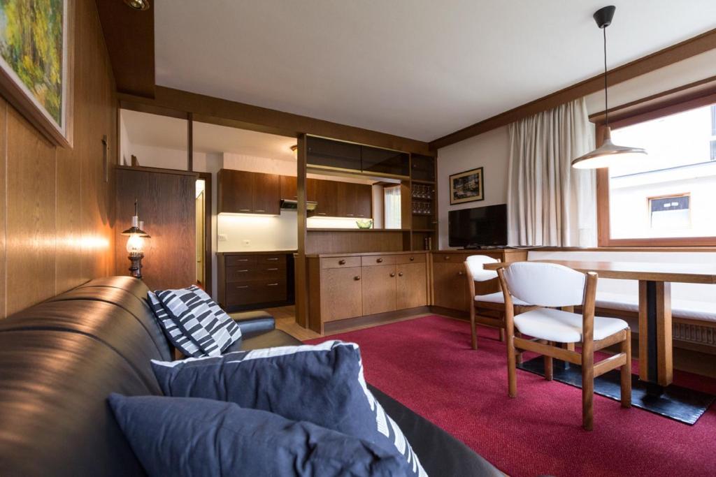 a living room with a couch and a table at Apartments Meisules in Ortisei