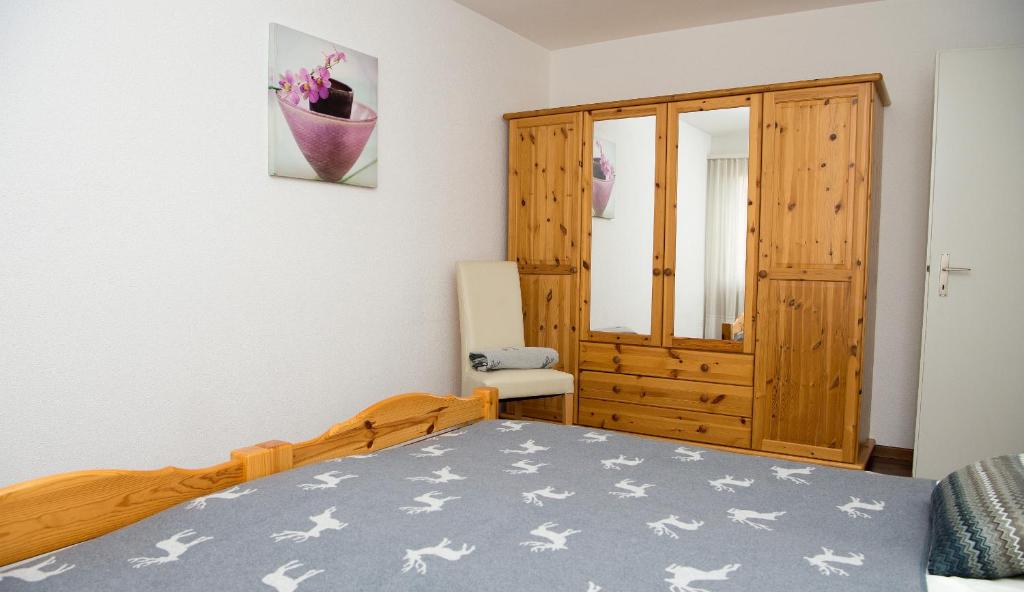 Postel nebo postele na pokoji v ubytování Central flat Crapera-Lenzerheide