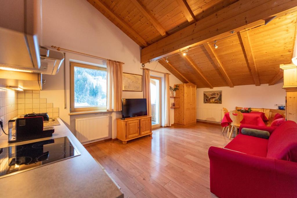 Televízia a/alebo spoločenská miestnosť v ubytovaní Apartments Agave