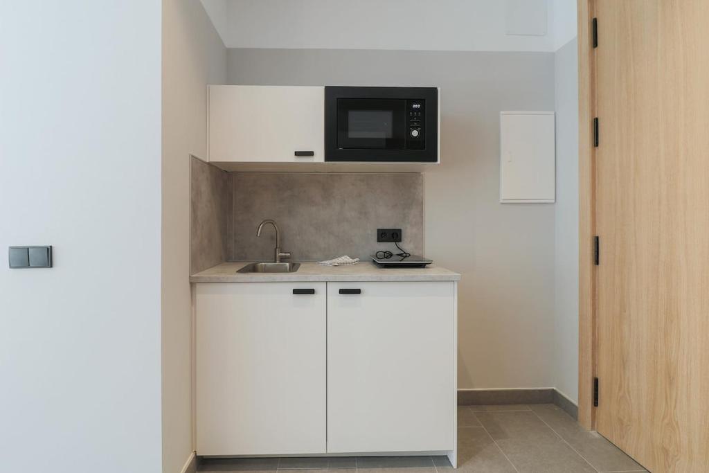 Kuchyňa alebo kuchynka v ubytovaní Victoria Suites 57