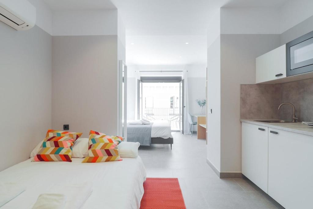 Posteľ alebo postele v izbe v ubytovaní Victoria Suites 57