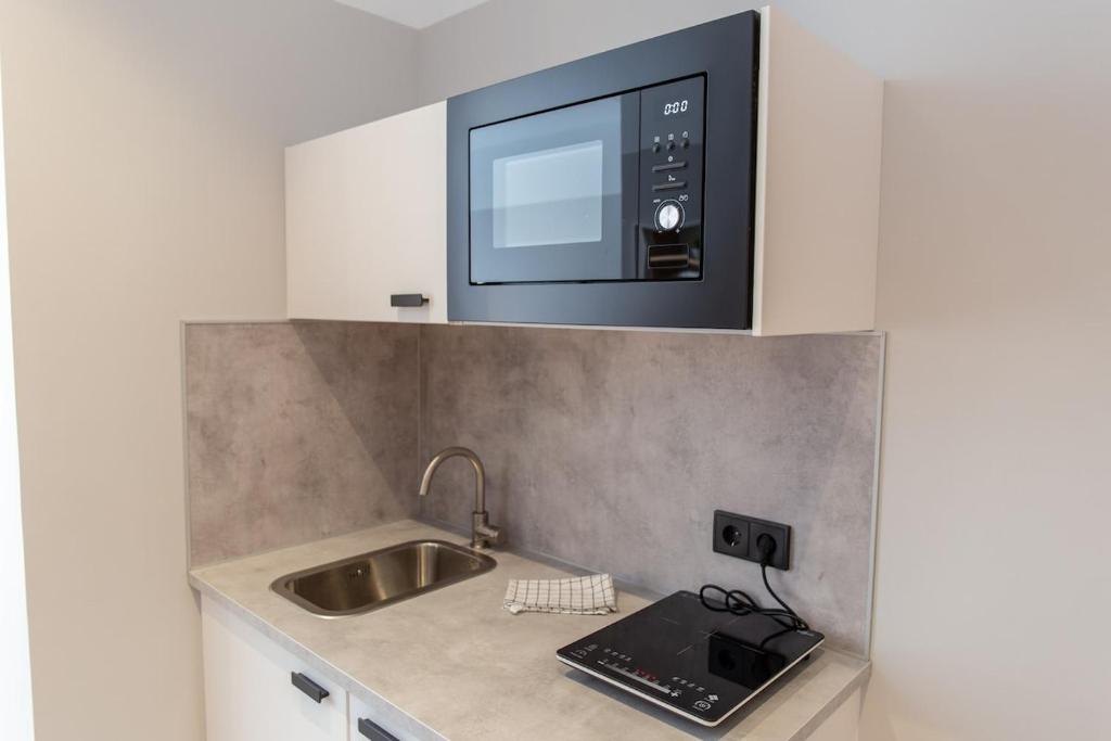 Kuchyňa alebo kuchynka v ubytovaní Victoria Suites 57