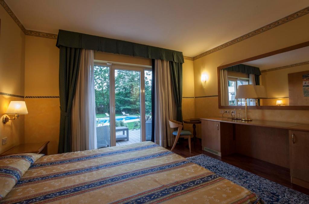 Posteľ alebo postele v izbe v ubytovaní Hotel Al Ponte